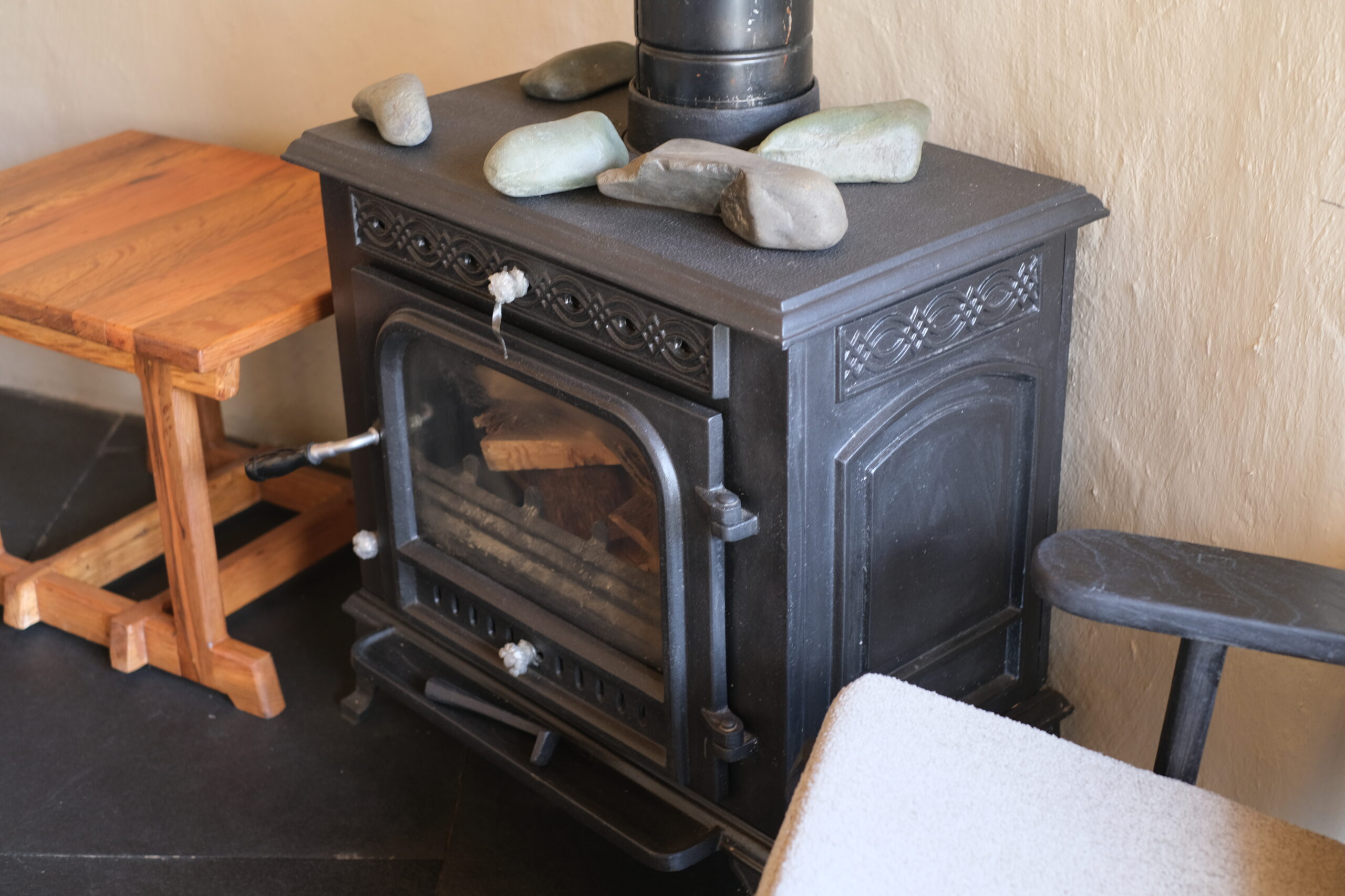 Experience authentic Ladakhi warmth with a traditional tandoor and a cozy seating area for relaxation.